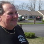 Vinnie Organtini with Cindy's former home behind him