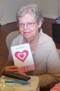 Barbara Fidow shows a card