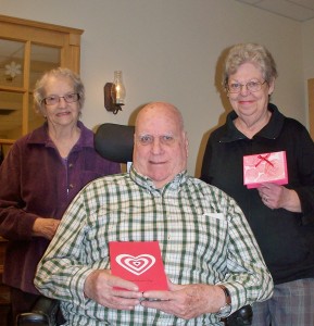 Ralph is pleased w his selection as Ruby and Barbara look on